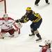 Michigan freshman center Justin Selman screens Miami goalie Ryan McKay on Saturday, March 23. Daniel Brenner I AnnArbor.com
